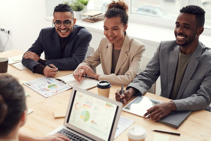 Colleagues working together in a bright office space